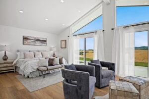 Interior of bedroom overlooking fields